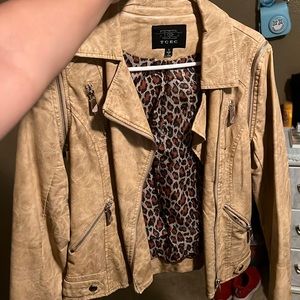 Tan-ish leather jacket that turns into vest